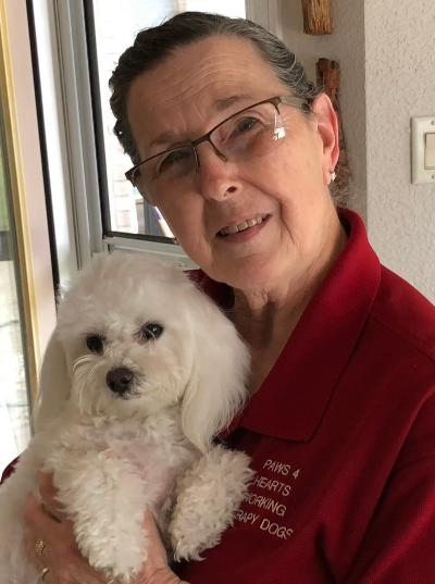 Linda with therapy dog Maggie